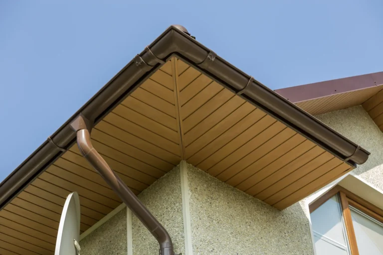 Wood-look aluminum soffit panels lining the underside of a roof overhang on a modern home
